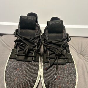 Adidas Black and Red Sneakers with Knit Upper and Cushioned Midsole